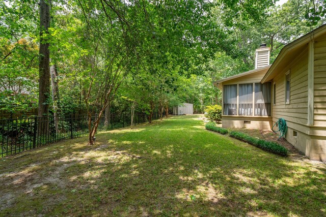 view of yard featuring a sunroom