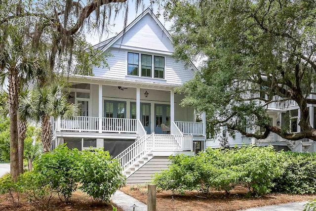 3305 Knot Aly, Johns Island, SC 29455 - view of front facade with covered porch, stairway, and a ceiling fan