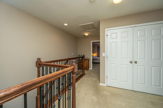 hallway with light carpet