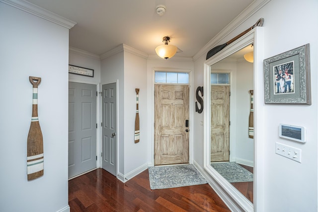 foyer entrance with crown molding and dark wood-type flooring