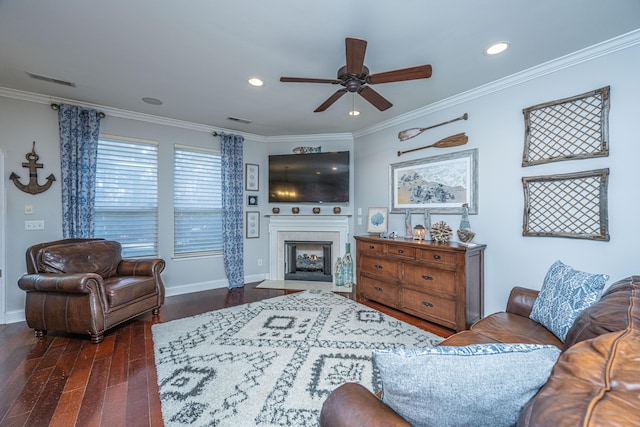 living room featuring dark hardwood / wood-style floors, ceiling fan, and ornamental molding