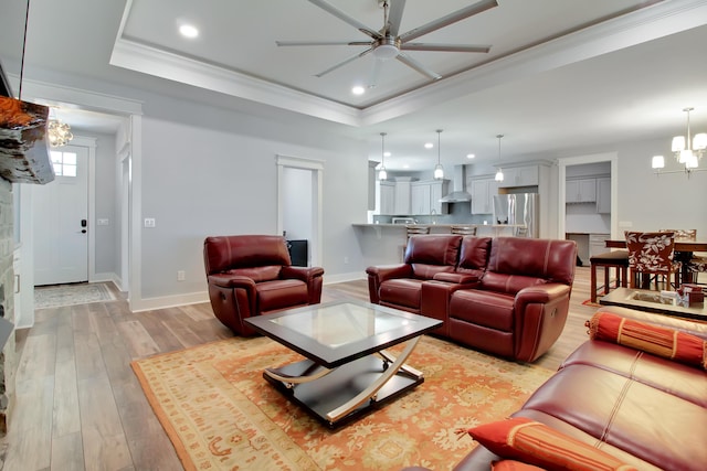 1543 Scott Hill Rd, James Island, SC 29412 - living room with a raised ceiling, a ceiling fan, a chandelier, recessed lighting, and light wood-style flooring