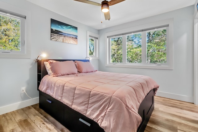 1543 Scott Hill Rd, James Island, SC 29412 - bedroom featuring baseboards, light wood finished floors, and ceiling fan