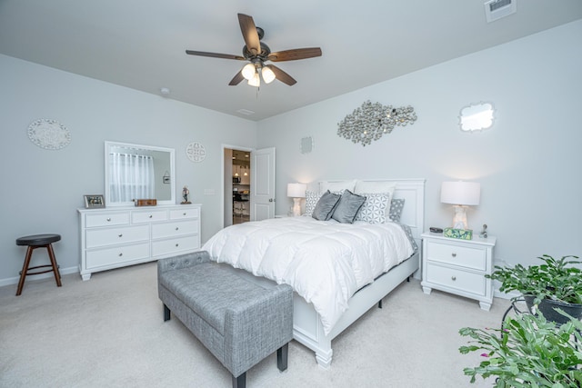 bedroom featuring ceiling fan and light carpet