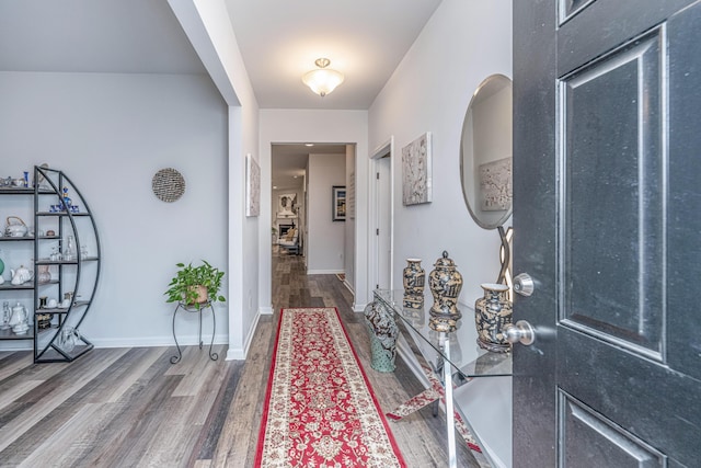 foyer with dark hardwood / wood-style floors