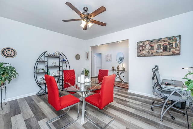 dining area featuring ceiling fan and hardwood / wood-style flooring