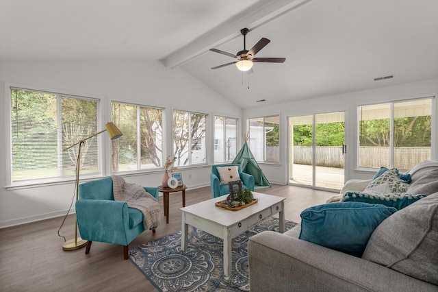 sunroom / solarium featuring wood finished floors and baseboards