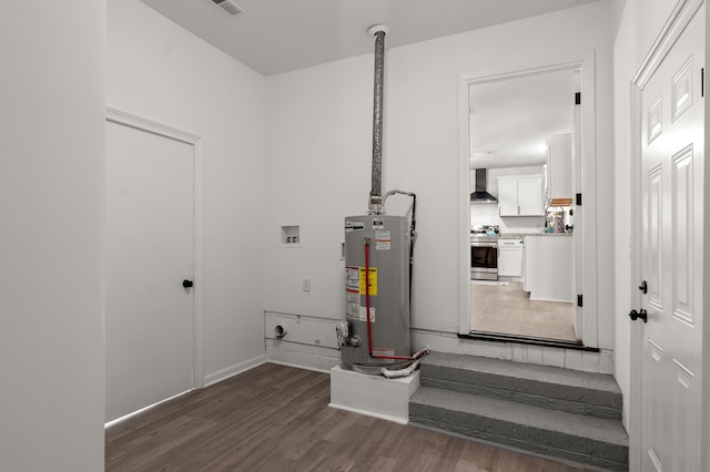 utility room featuring gas water heater