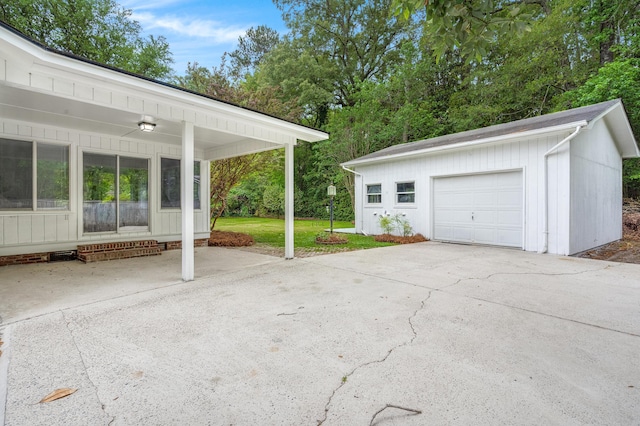 detached garage featuring driveway