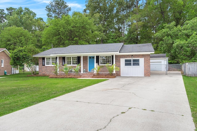 ranch-style house with covered porch, driveway, and brick siding