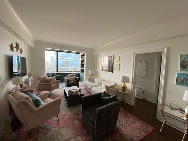 living area with wood finished floors