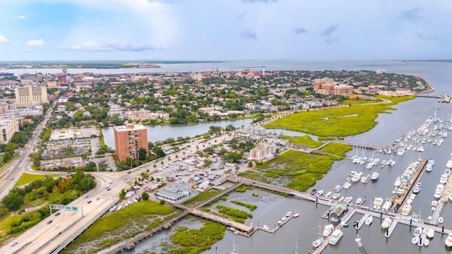 birds eye view of property with a water view and a view of city