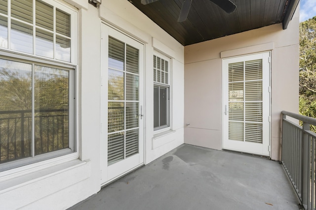 balcony featuring a ceiling fan and a sunroom