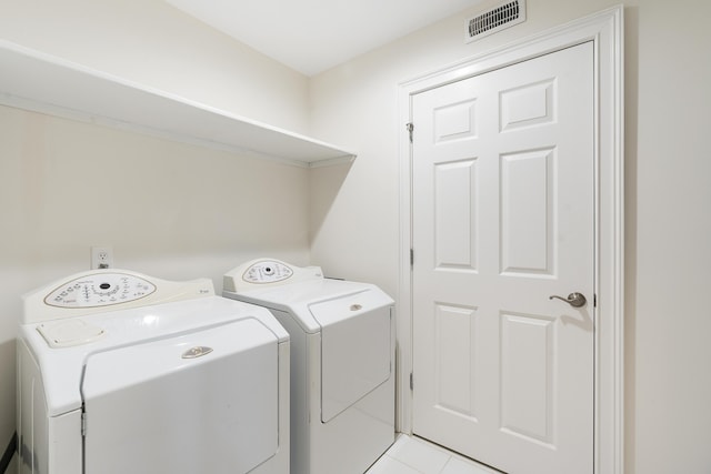 laundry room featuring laundry area, washer and dryer, and visible vents