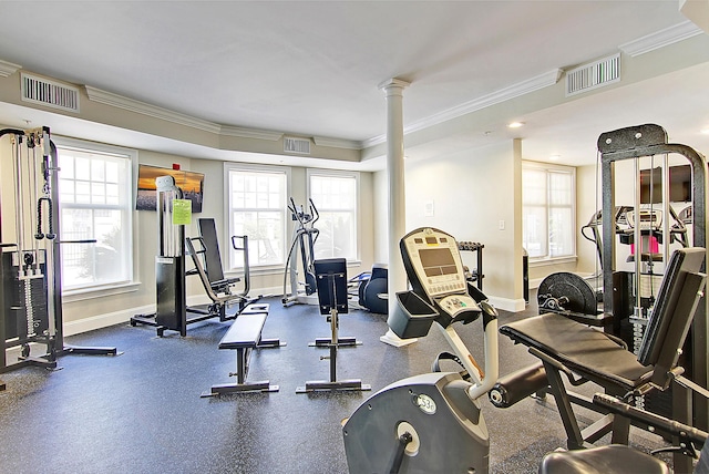 workout area with crown molding, baseboards, and visible vents