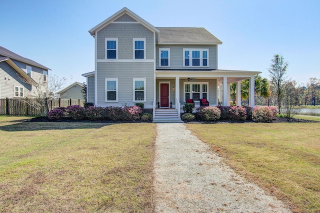 view of front of home with covered porch and a front yard