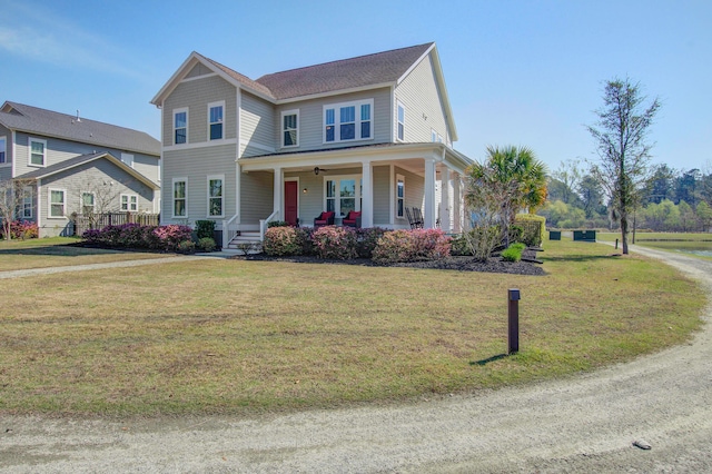 view of front facade featuring covered porch and a front yard