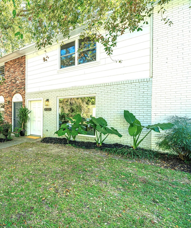 view of property exterior featuring a yard