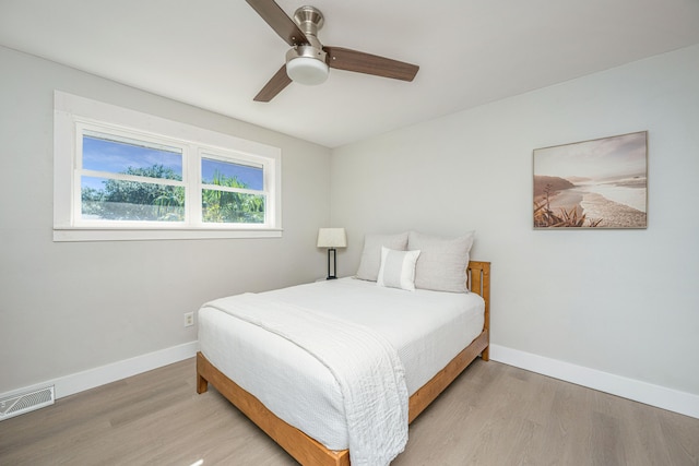 bedroom featuring light wood-type flooring and ceiling fan