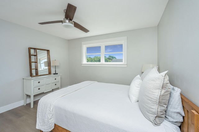 bedroom featuring hardwood / wood-style flooring and ceiling fan