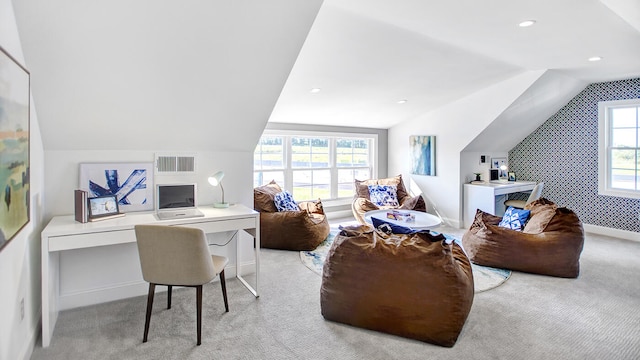 interior space with lofted ceiling and a wealth of natural light