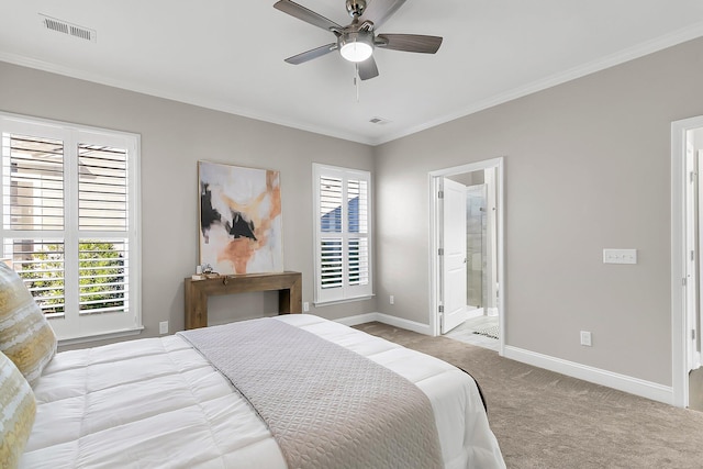 carpeted bedroom with connected bathroom, ornamental molding, and ceiling fan