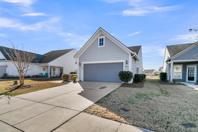 view of front of home featuring a garage and a front yard