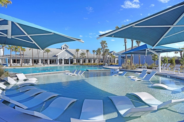 view of swimming pool featuring a jacuzzi