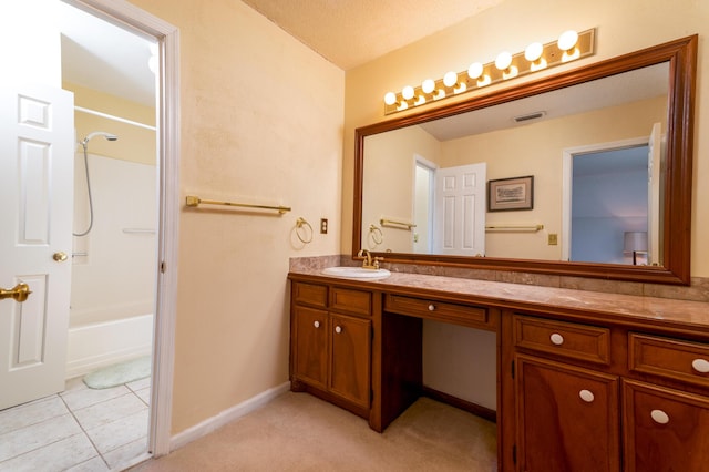 full bath featuring visible vents, baseboards, washtub / shower combination, tile patterned floors, and vanity