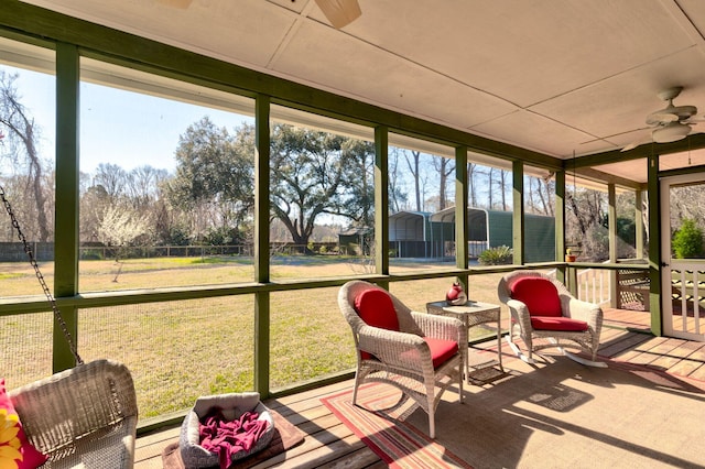 sunroom with a ceiling fan