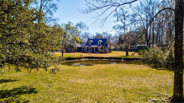 view of yard with a water view