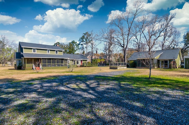 view of yard with a sunroom