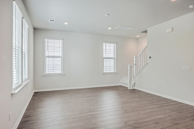 empty room featuring dark hardwood / wood-style flooring