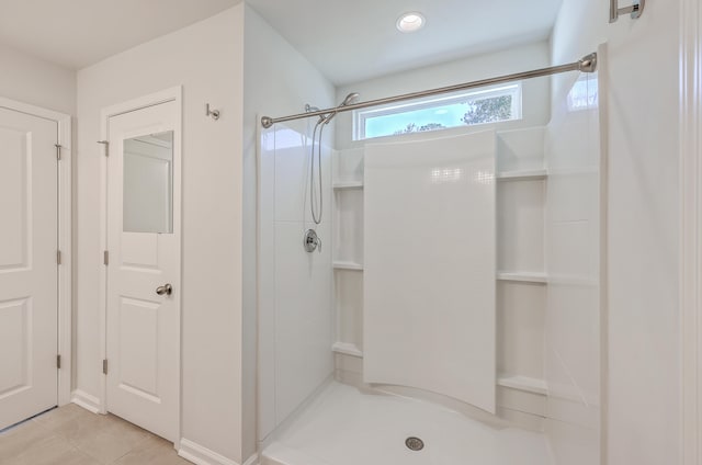 bathroom featuring tile patterned flooring and a shower