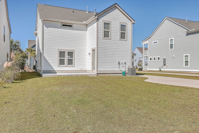 back of house featuring a yard