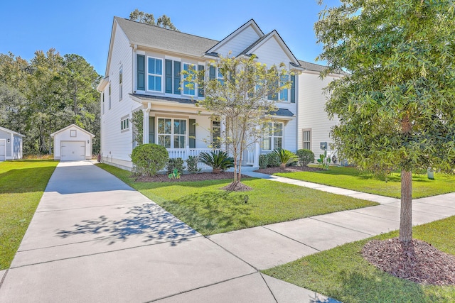 view of front of property featuring a porch, a garage, an outdoor structure, and a front yard