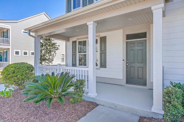 doorway to property with a porch