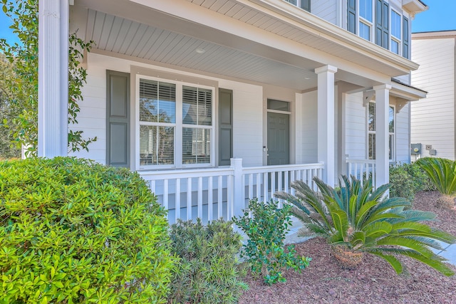 entrance to property featuring covered porch