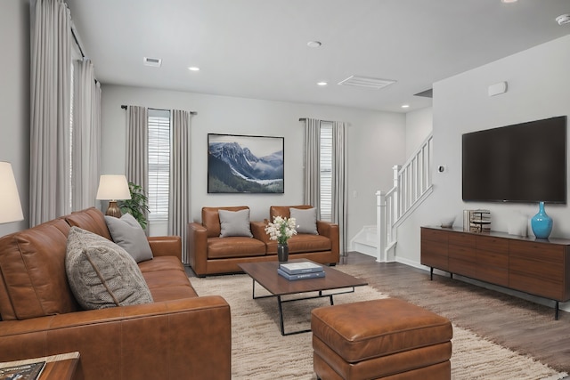 living room with light hardwood / wood-style flooring