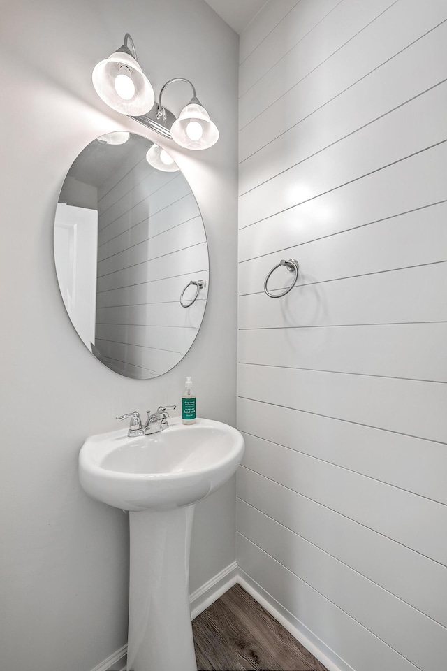 bathroom with wood-type flooring