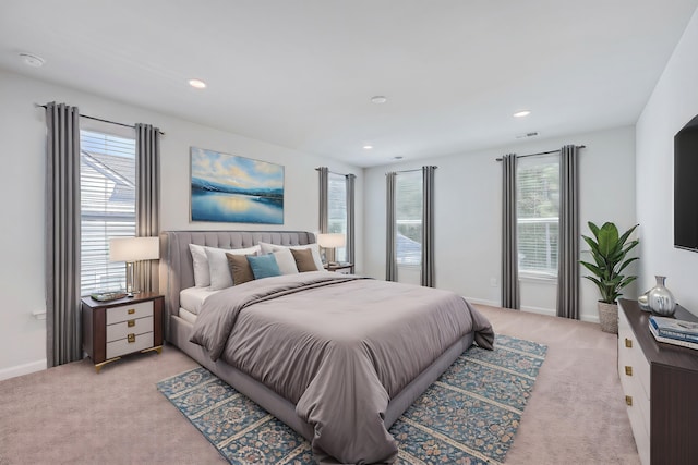 bedroom featuring light colored carpet