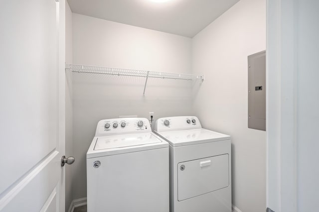 laundry room with separate washer and dryer and electric panel