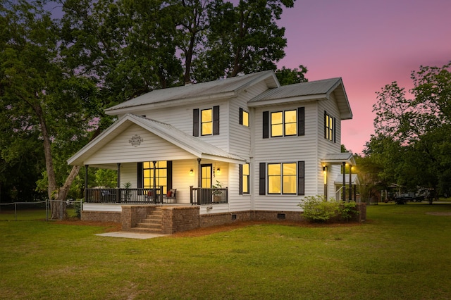285 Roosevelt Dr, Saint Stephen, SC 29479 - back of property at dusk with a porch, metal roof, and crawl space