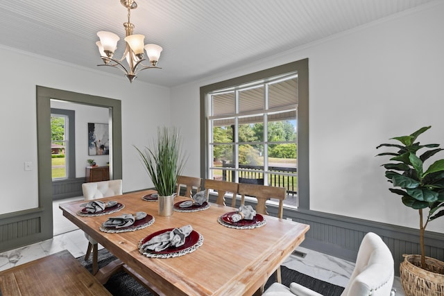 285 Roosevelt Dr, Saint Stephen, SC 29479 - dining room featuring light marble finish floors, a chandelier, and crown molding