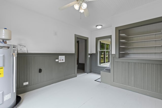 285 Roosevelt Dr, Saint Stephen, SC 29479 - unfurnished room with water heater, ceiling fan, wainscoting, and concrete floors