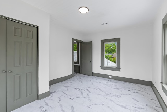 285 Roosevelt Dr, Saint Stephen, SC 29479 - unfurnished bedroom featuring marble finish flooring and baseboards