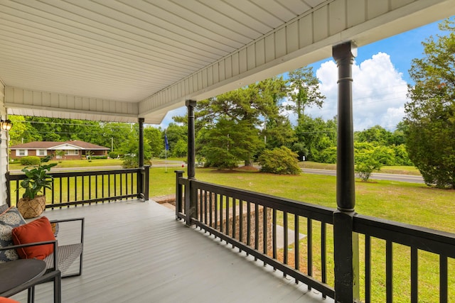 285 Roosevelt Dr, Saint Stephen, SC 29479 - wooden deck with a porch, a yard, and view of wooded area