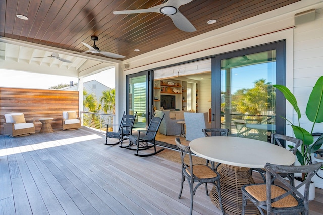 wooden deck with ceiling fan