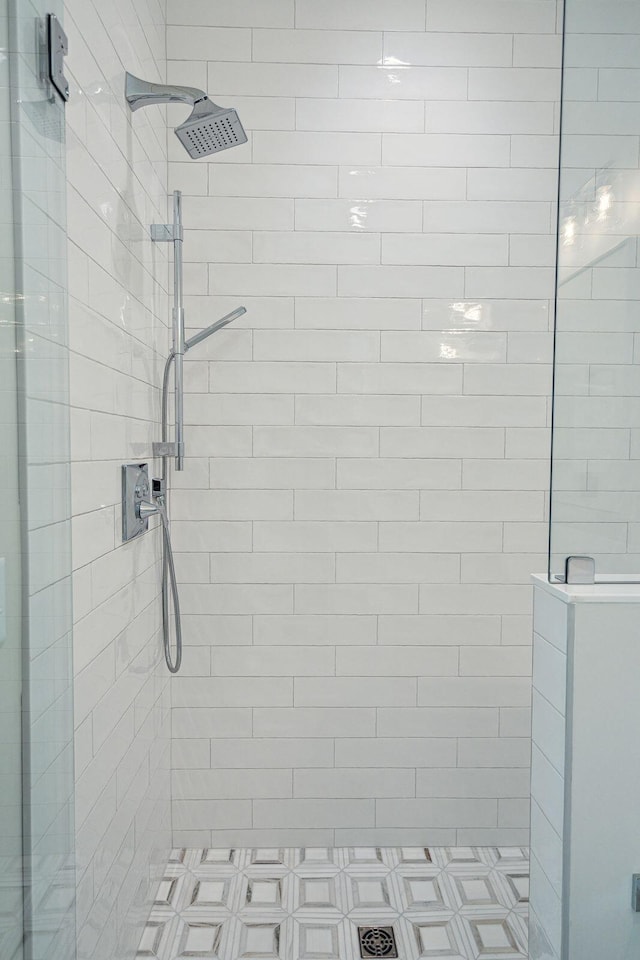 bathroom with a tile shower