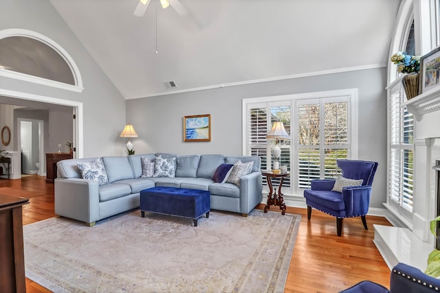 2707 Waterpointe Cir, Mount Pleasant, SC 29466 - living room with wood finished floors, high vaulted ceiling, ceiling fan, and a fireplace with raised hearth